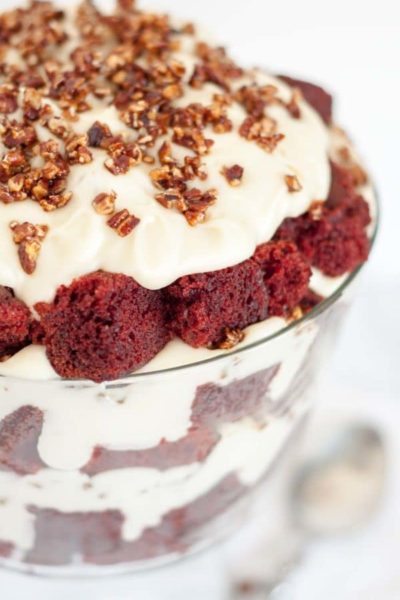 red velvet cake layered in a glass trifle dish