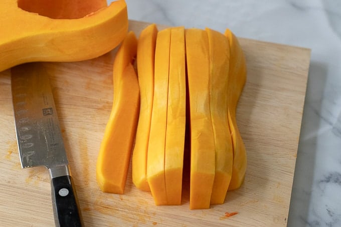 pictures showing how to cut a butternut squash