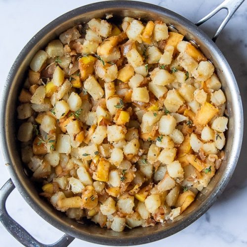 potatoes, apples, and onions in a skillet