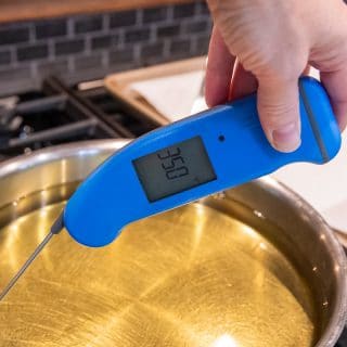 a thermometer in a pan of oil