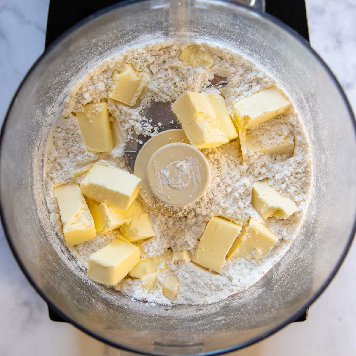 butter in the dry ingredients in a food processor.