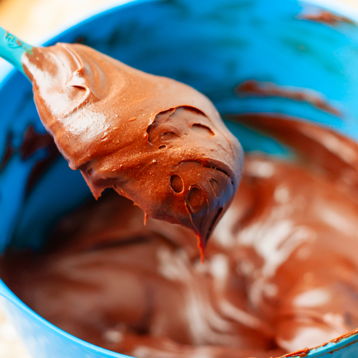 ganache thickened on a spoon.