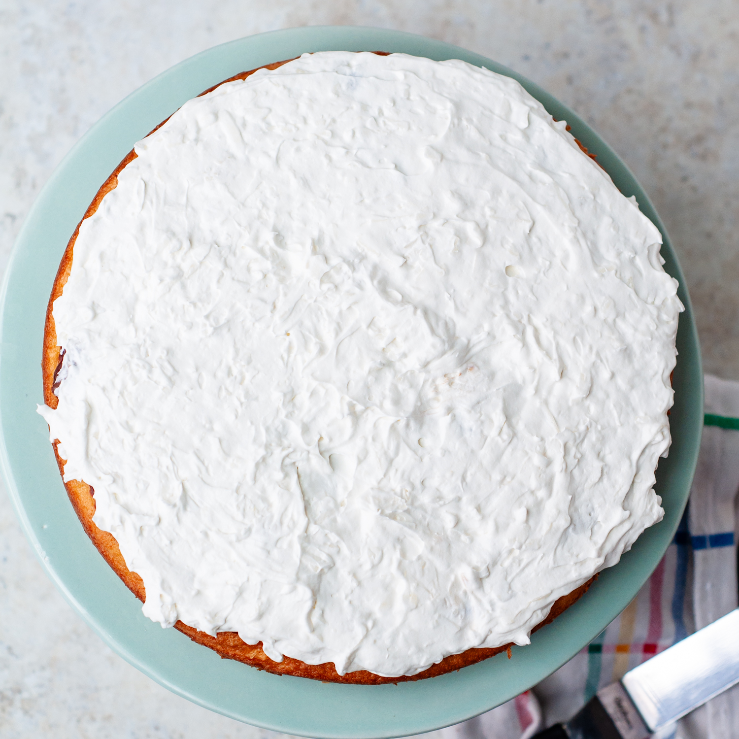 coconut frosting spread on a layer.