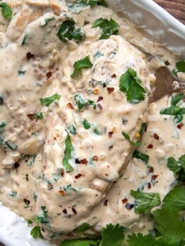 overhead shot of creamy cilantro lime chicken with side of rice next to it
