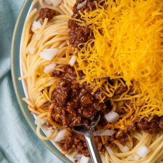 overhead shot of cincinnati chili with a fork going into spaghetti