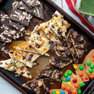 a baking sheet filled with different types of chocolate bark recipes