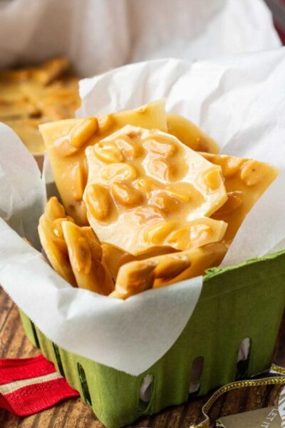 peanut brittle in a green holiday box