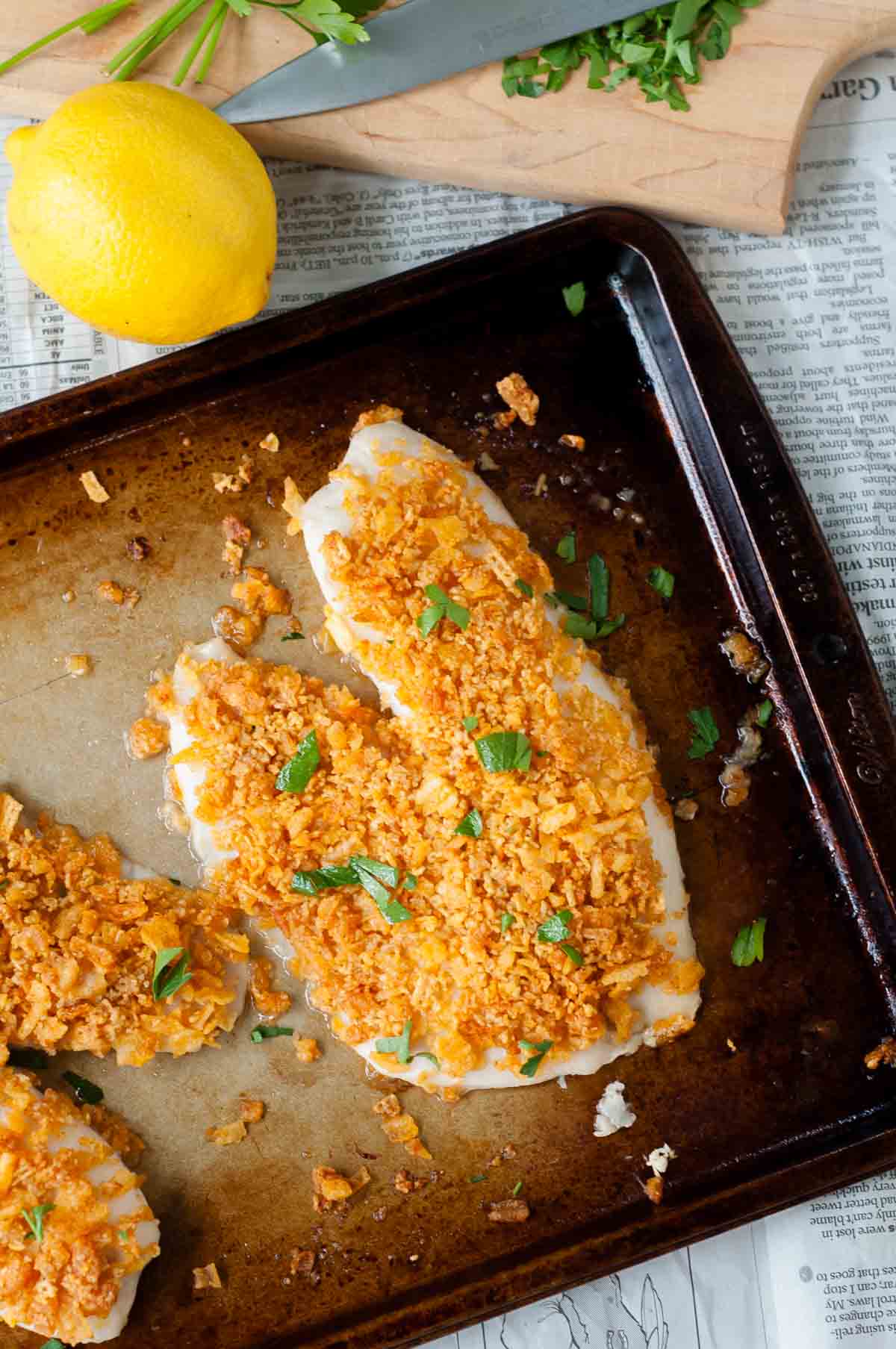 overhead shot of baked fish on a baking sheet.