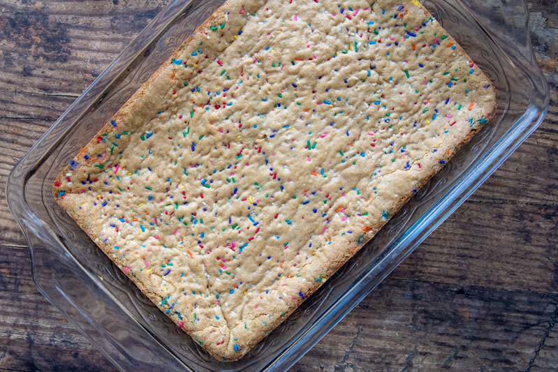 unfrosted gluten free sugar cookie bars in a glass 9X13 pan