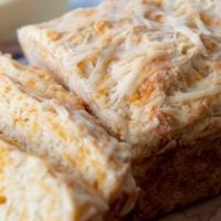 an up close shot of the top of quick cheese bread