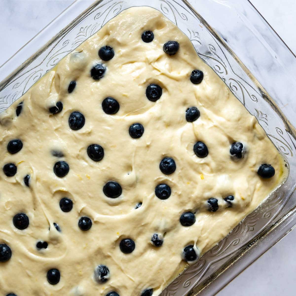 blueberries on top of unbaked cake.