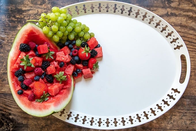 how to make a dessert platter second step - filling watermelon with fruit