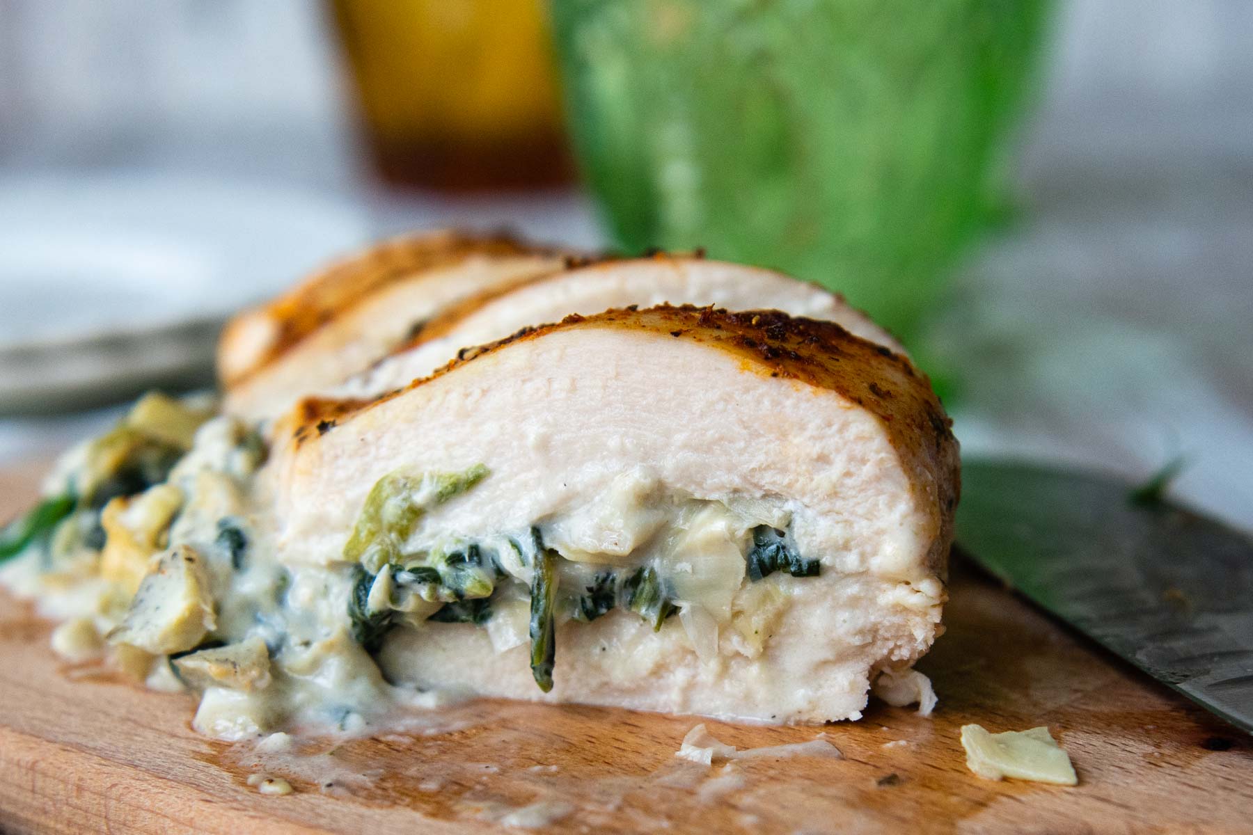 close up of the inside of stuffed chicken breasts.