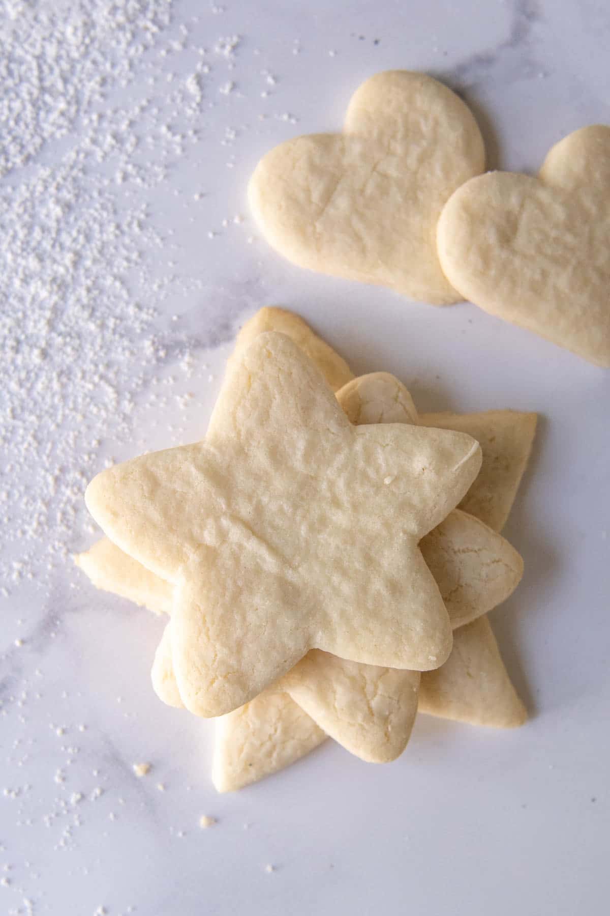 unfrosted sugar cookies on white marble
