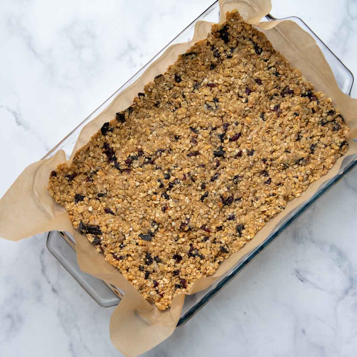 unbaked bars in a baking dish.