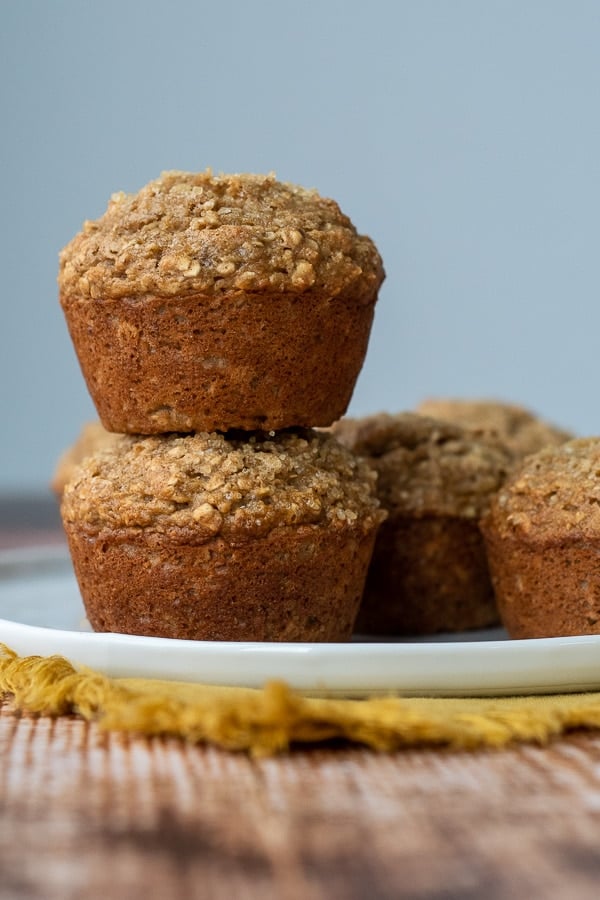a stack of two applesauce muffins on a white plate