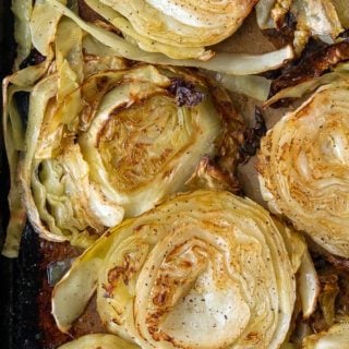 overhead shot of roasted cabbage on a baking sheet