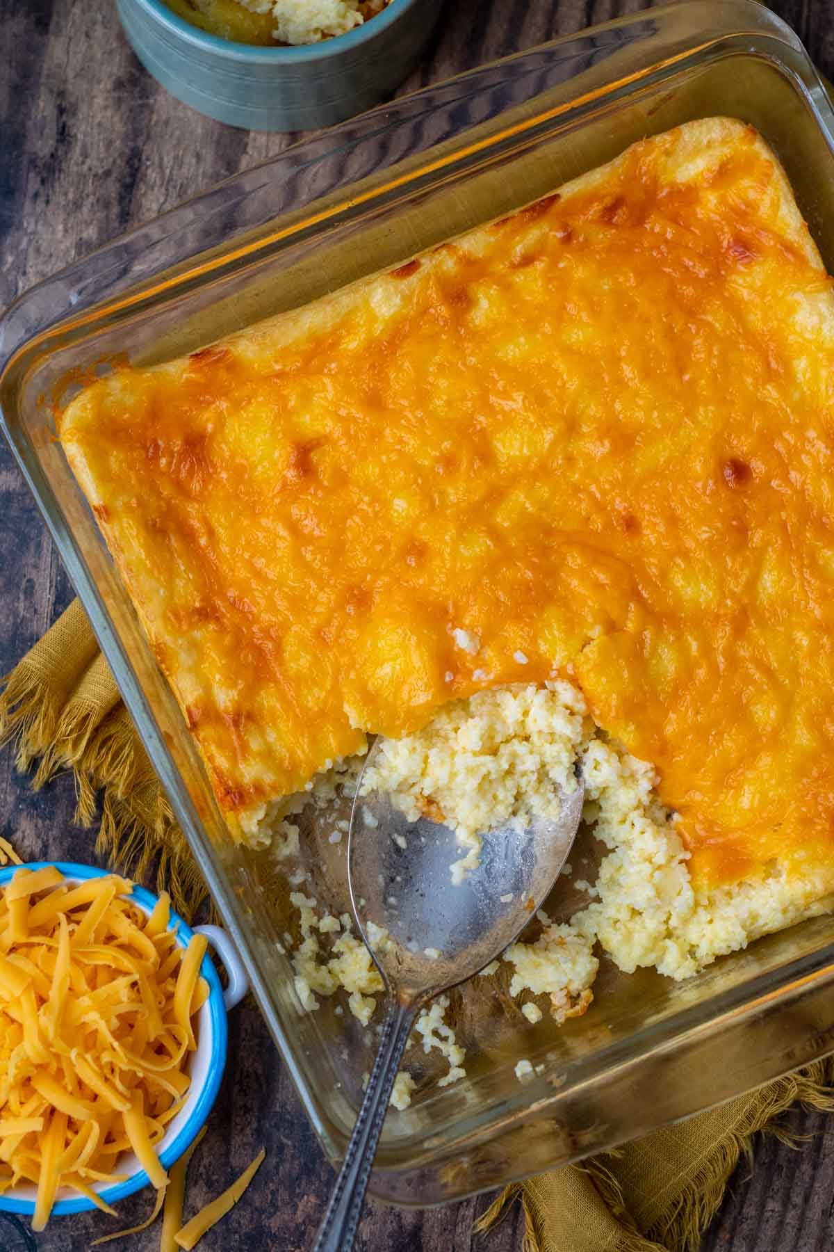 overhead shot of grits casserole with cheese on top