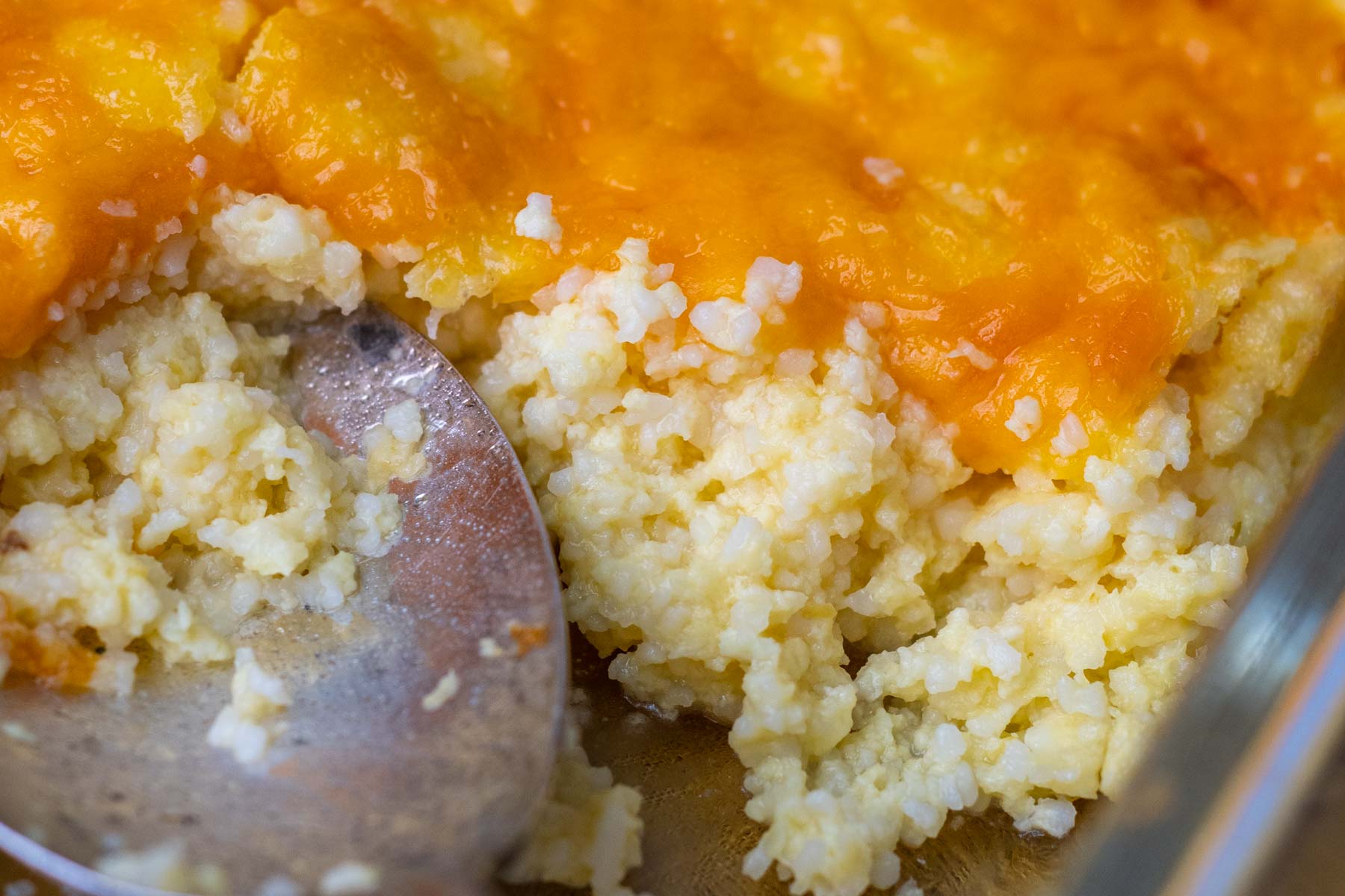 close up of the inside of cheese grits casserole