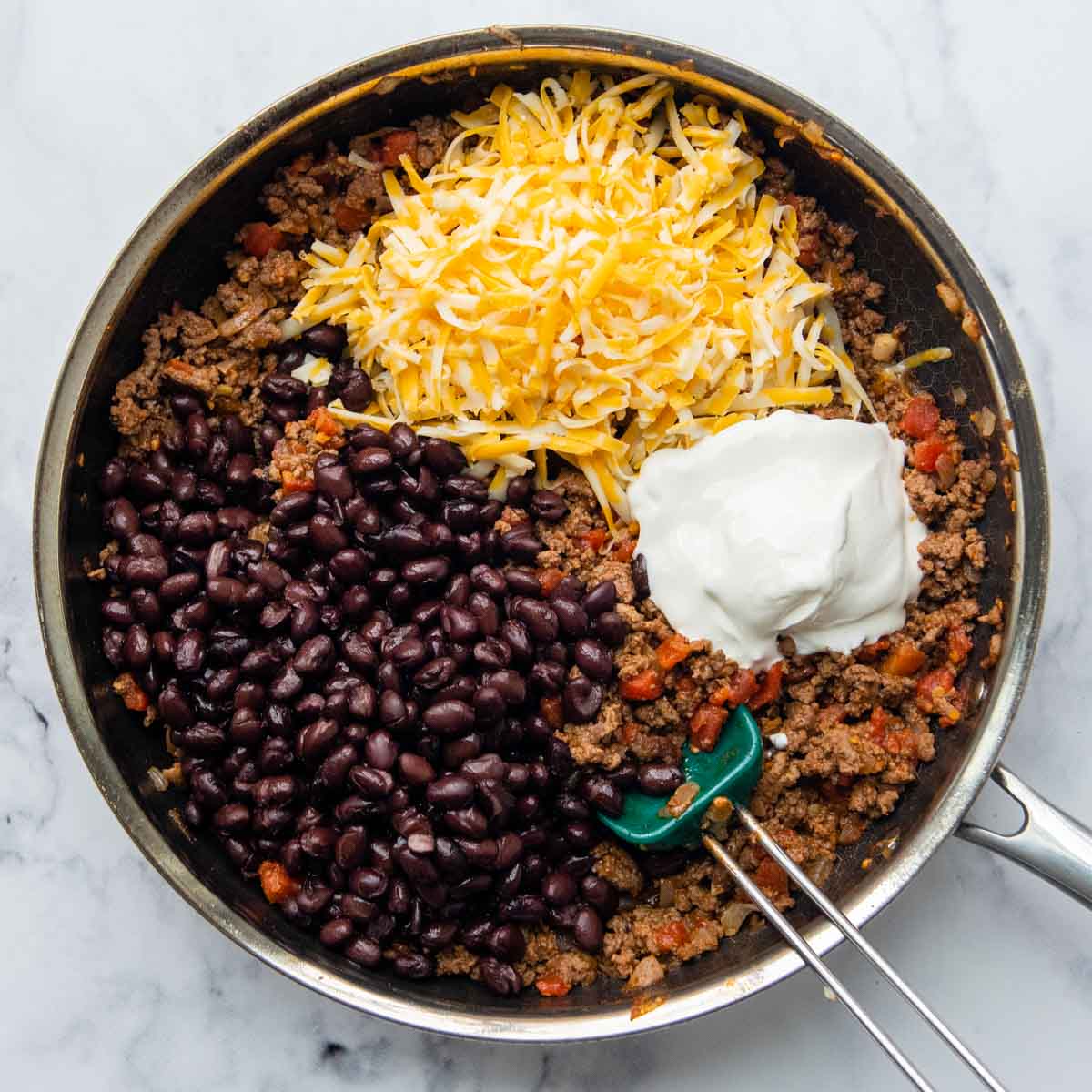 beans, cheese, and sour cream added to mixture.