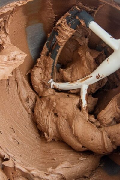 final chocolate frosting in a bowl of a stand mixer