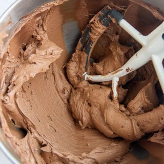 final chocolate frosting in a bowl of a stand mixer