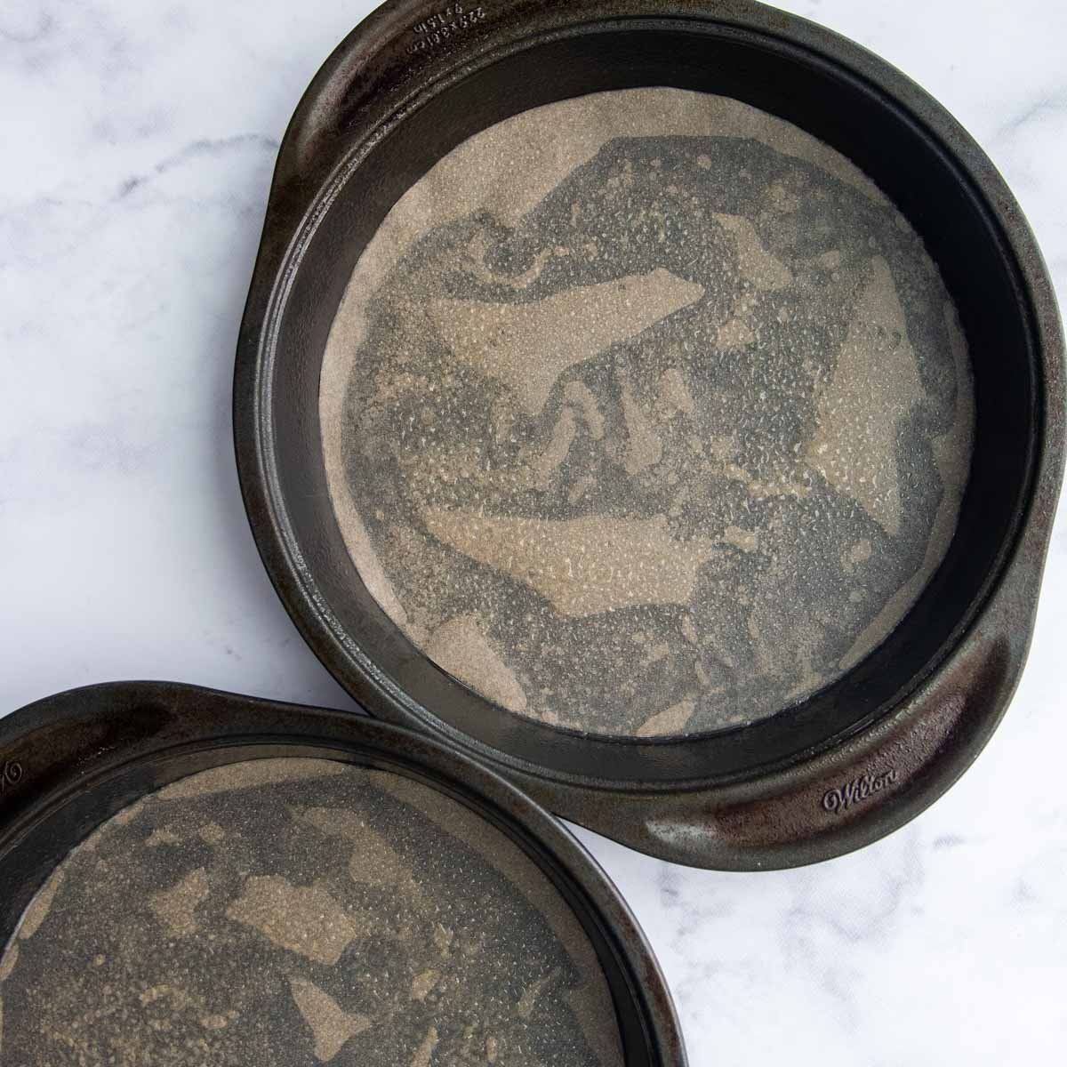 two unfilled round cake pans.