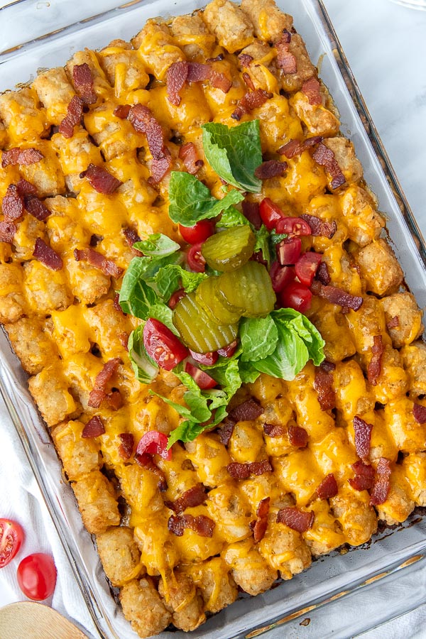 overhead shot of tater tot casserole with cheeseburger fixings on top