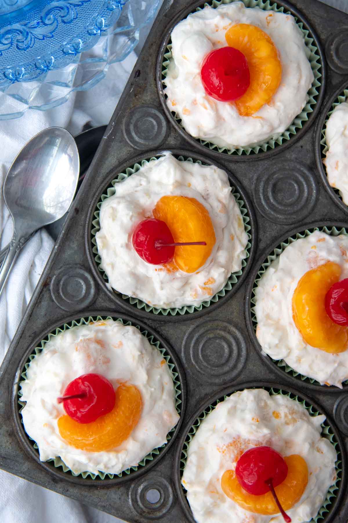 overhead shot of frozen fruit salad cups in an old fashioned muffin tin