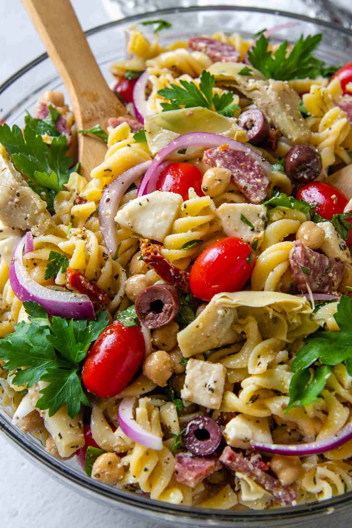 close up of gluten-free pasta salad in glass bowl.