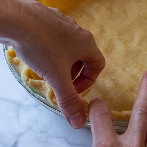 showing how to flute a pie crust edge