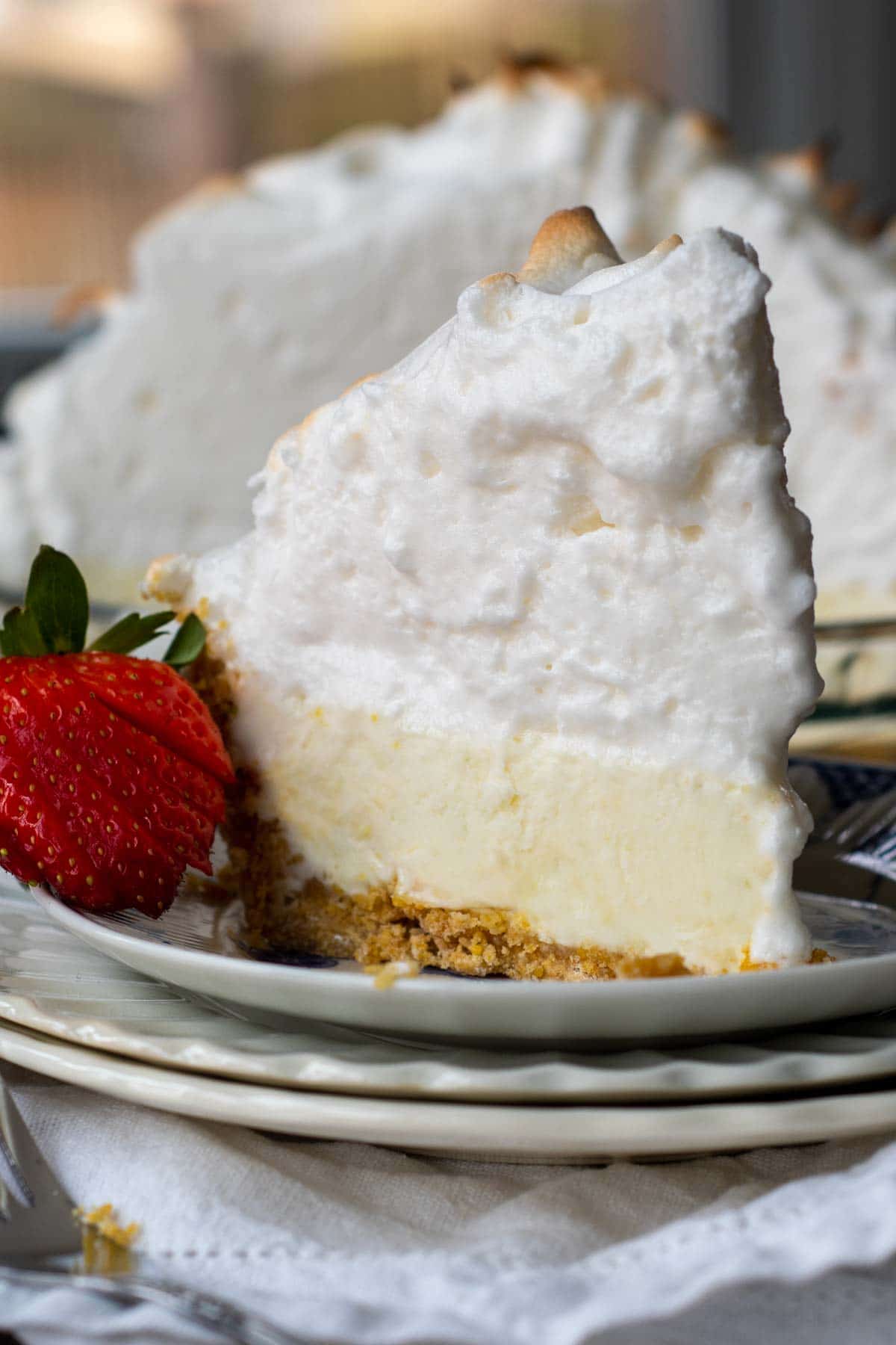 a slice of frozen pie on a plate with meringue topping