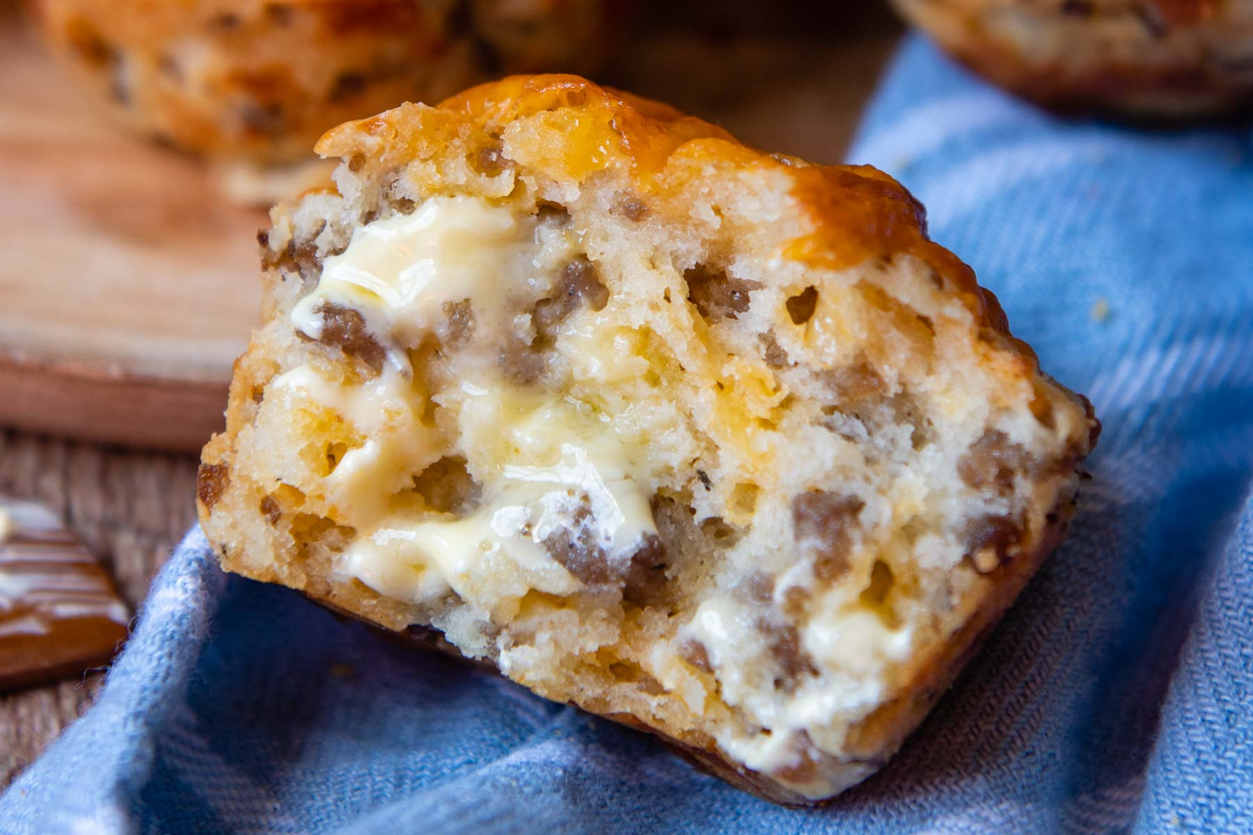 the inside of a sausage muffin with melting butter