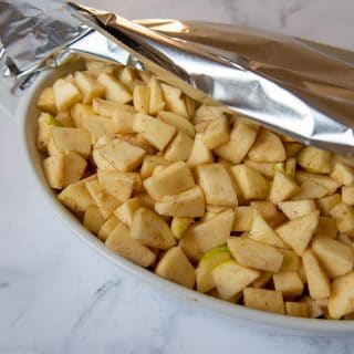 foil partially covering apple filling before baking