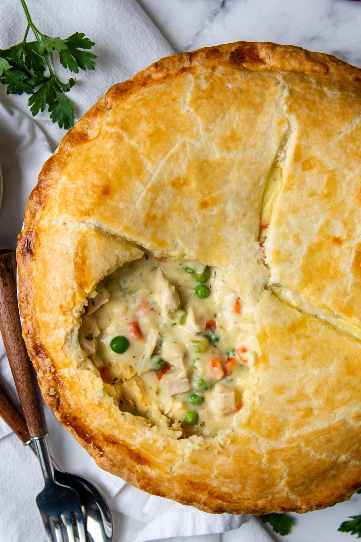 overhead shot of gluten-free pot pie with an opening showing filling