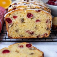 gluten free cranberry bread sliced and facing straight out on a cooling rack