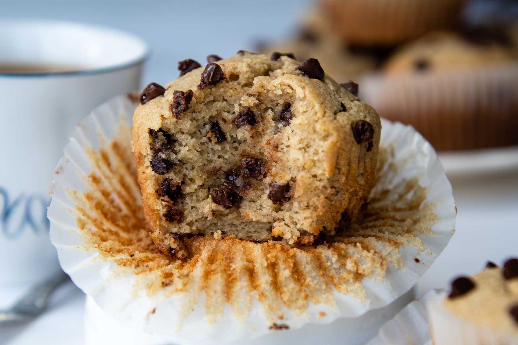 a muffin with a bite taken out facing straight on camera.