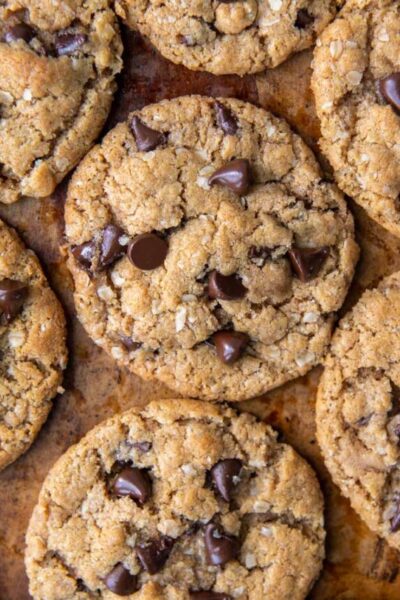 flat lay of chocolate chip cookies on a brown background