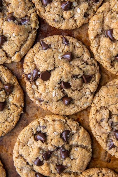 flat lay of chocolate chip cookies on a brown background