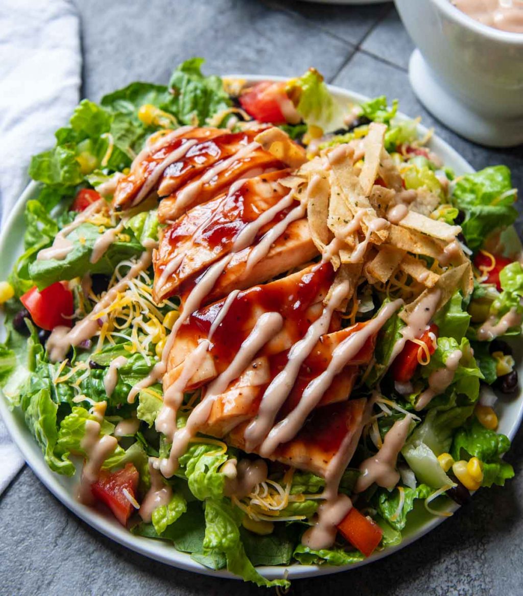 bbq chicken salad with ranch dressing drizzled over top