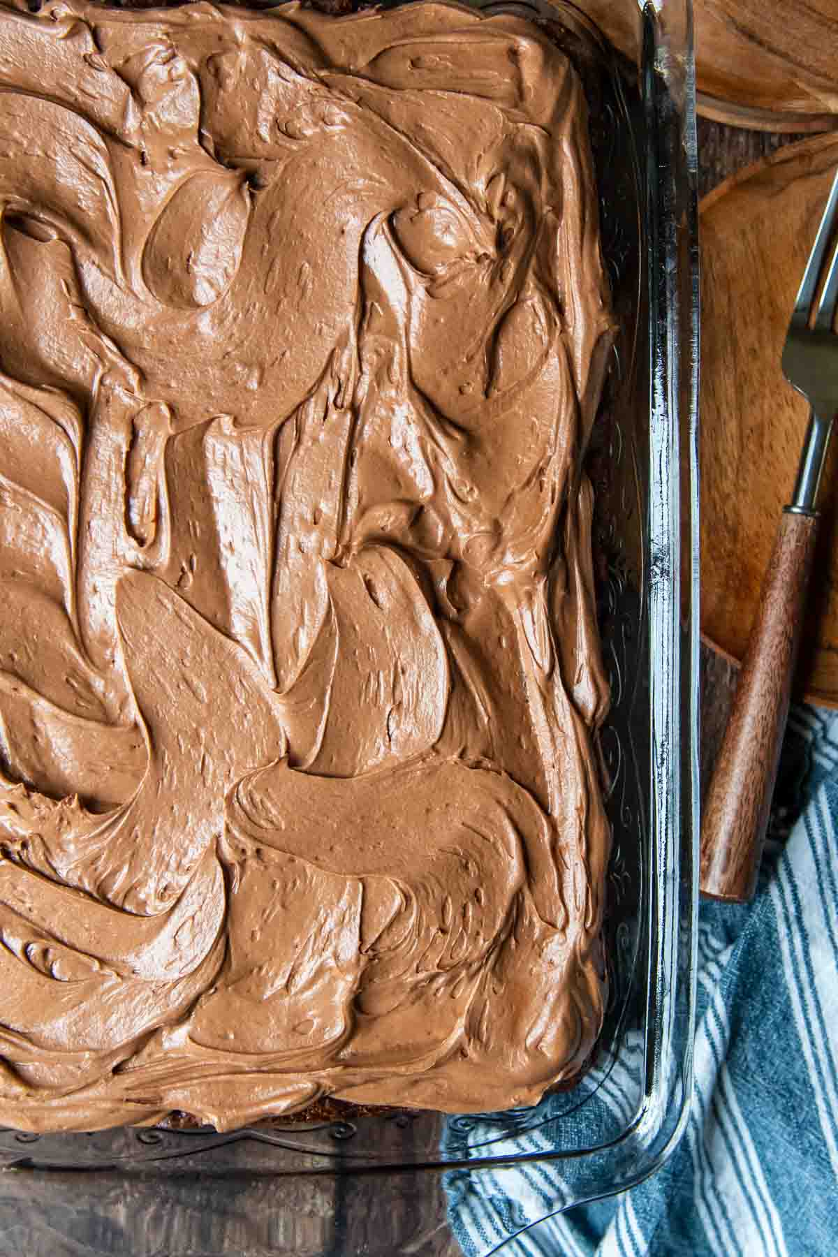 overhead shot of chocolate zucchini cake with chocolate frosting