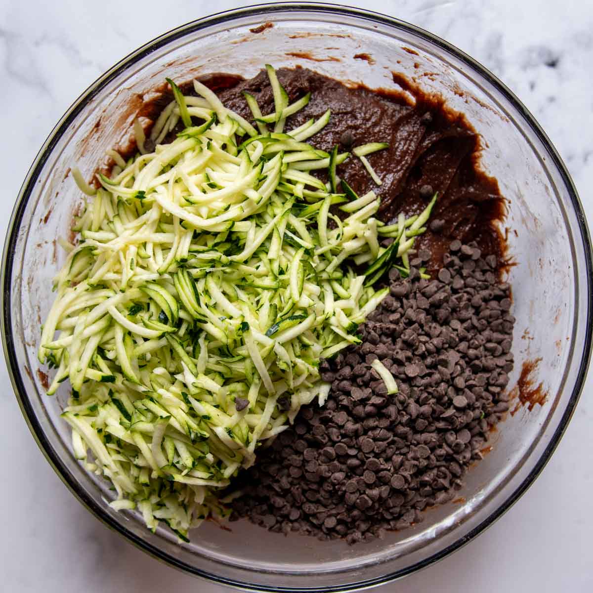 images showing adding grated zucchini to the cake batter