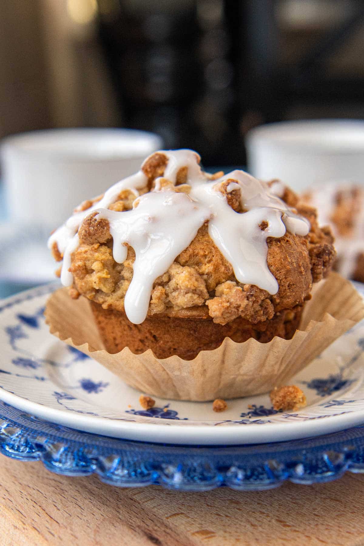 a gluten-free apple muffin partially unwrapped from a paper liner
