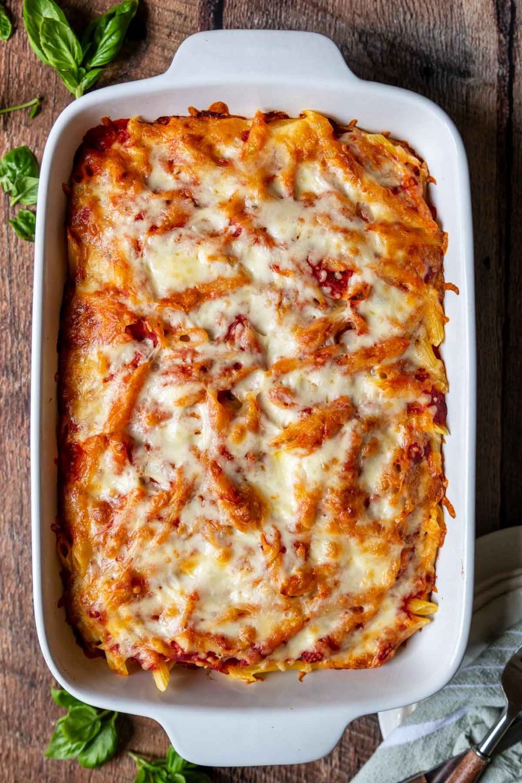 overhead shot of baked ziti in a white baking dish