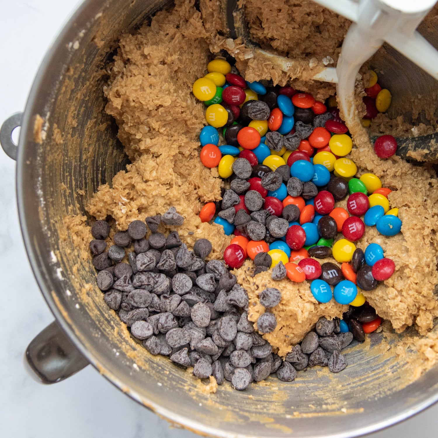 the chocolate chips and M&Ms added to the cookie dough.