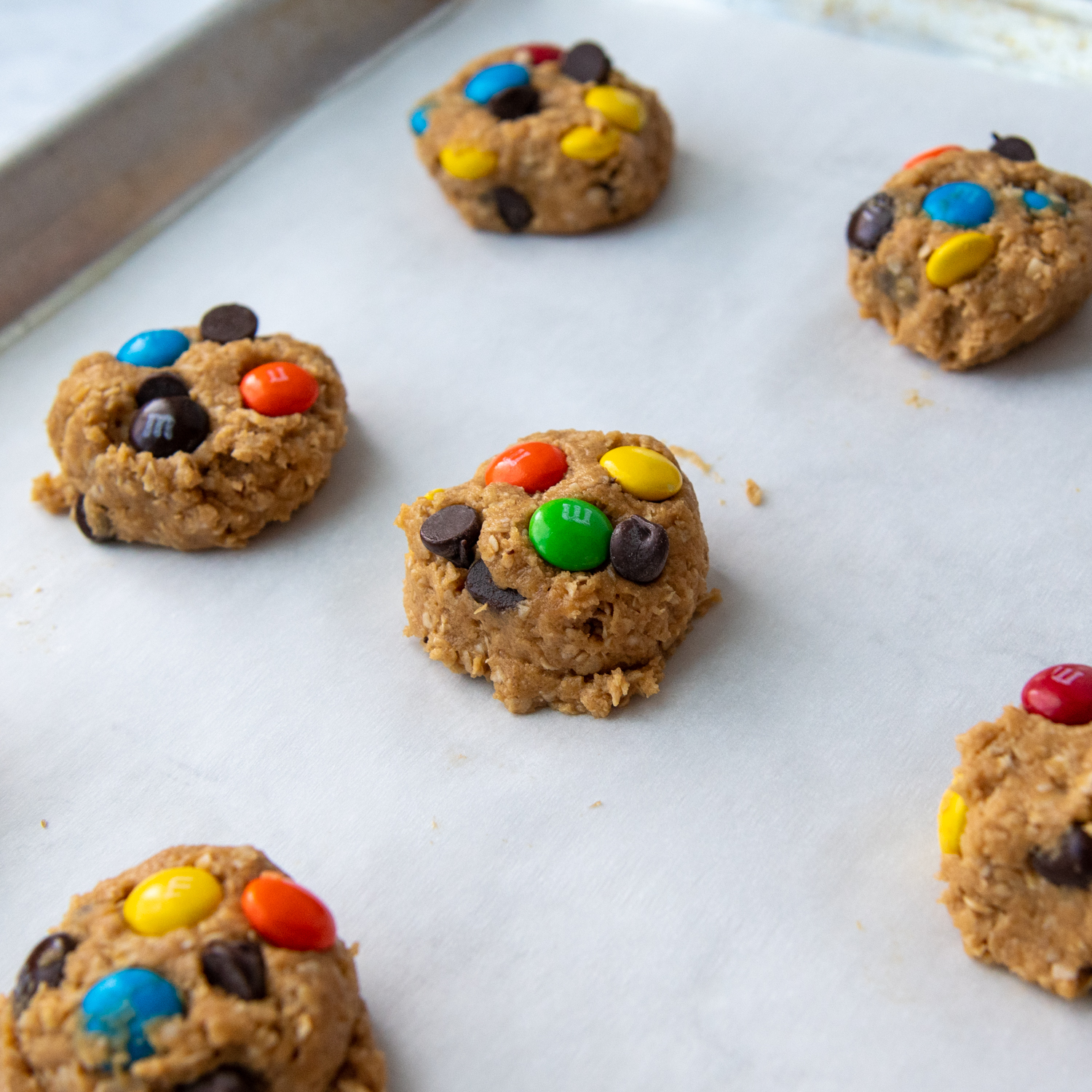 the shaped unbaked cookies on a cookie sheet.