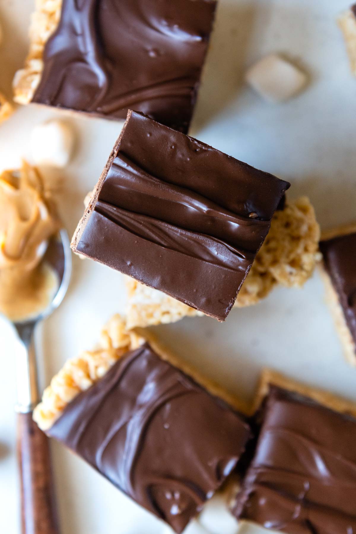 overhead shot of rice crispy bars with chocolate topping.