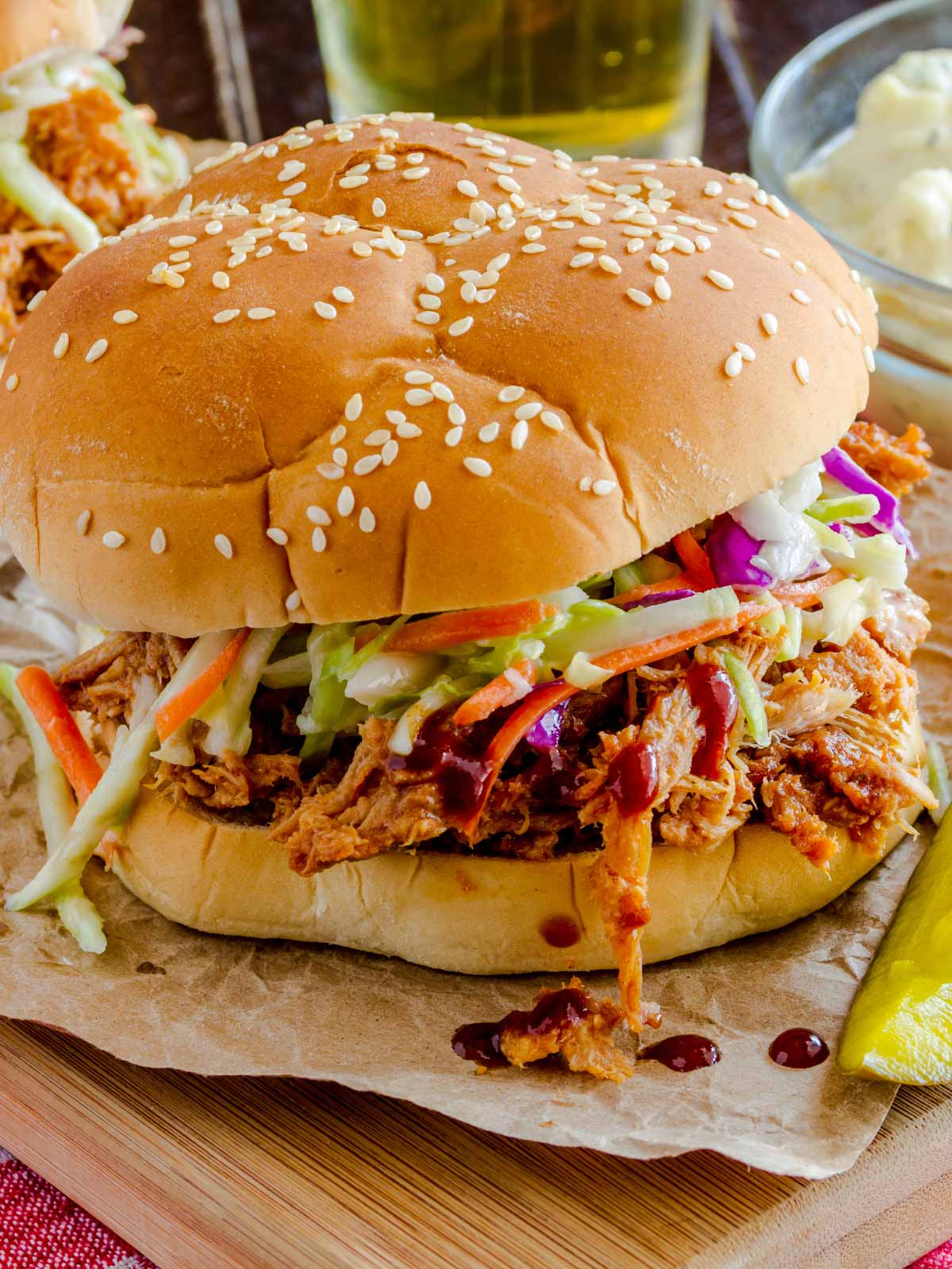 a pulled pork sandwich with coleslaw on top