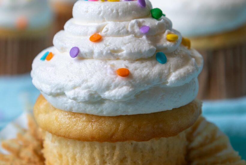 close up of frosting cupcake unwrapped