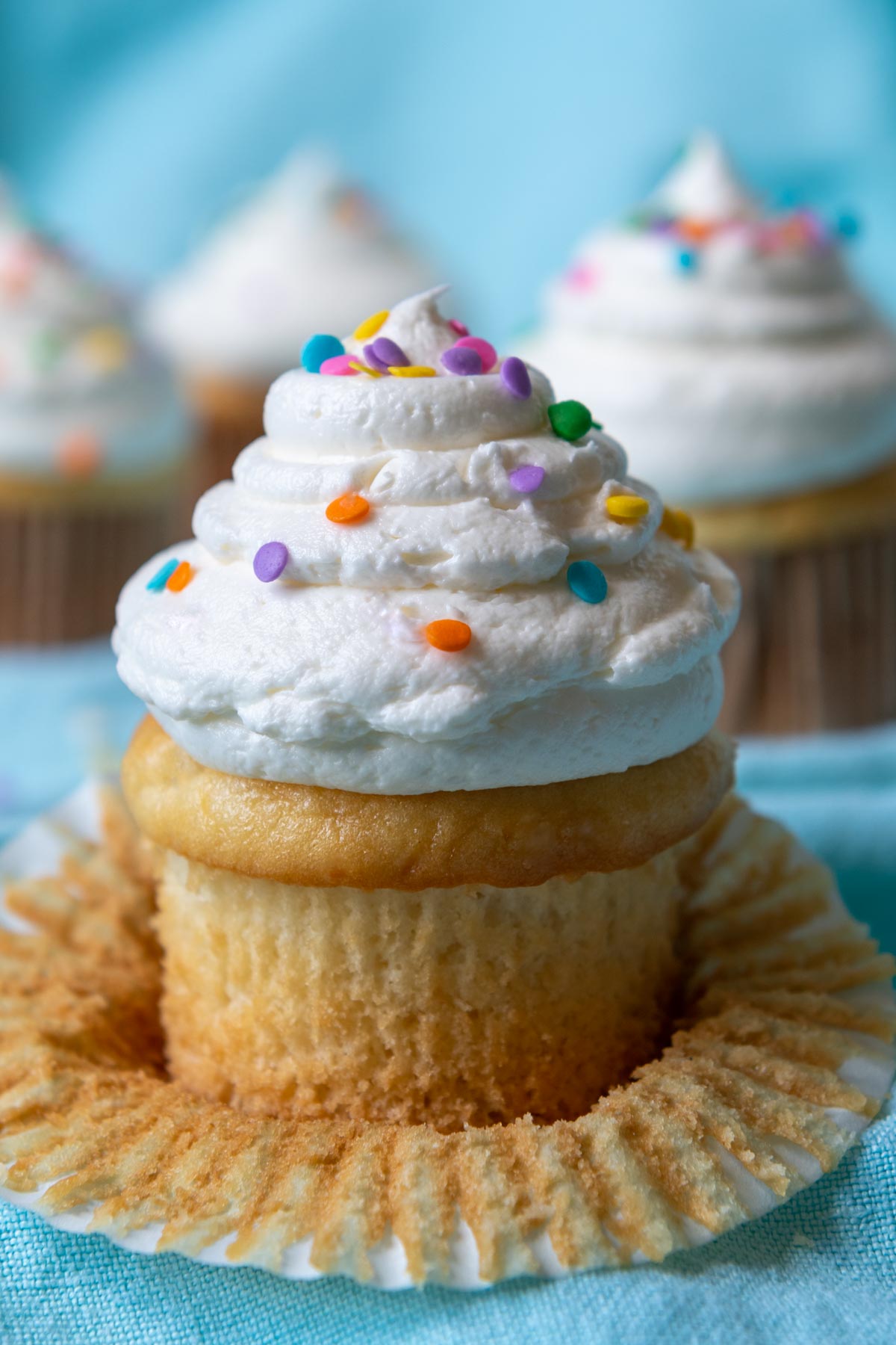 close up of frosting cupcake unwrapped